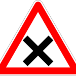 Kræftens signalveje symboliseret ved advarselstrekant med sort kryds i.