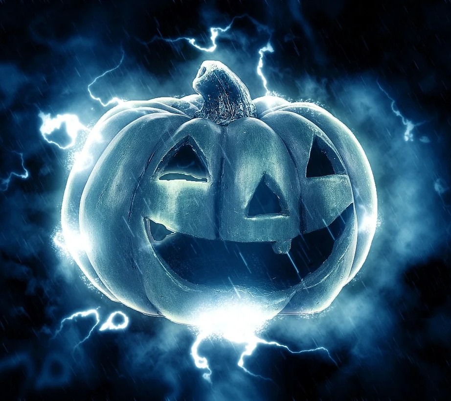 Elle Macpherson valg symboliseret ved en abstrakt lysfigur der ser ud som en kvindefigur i en lysende græskar.