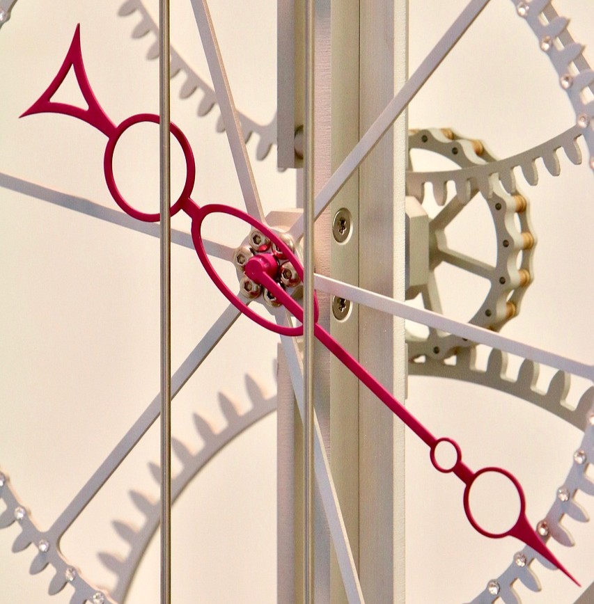 Tumormarkører symboliseret ved et spinkelt urværk i hvidt med rød viser.