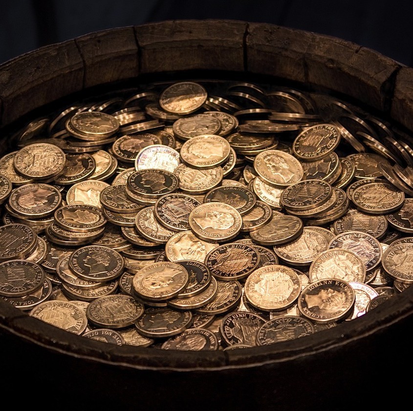 Støtteforeningen Jeg har Kræft symboliseret ved en bøtte med mønter.